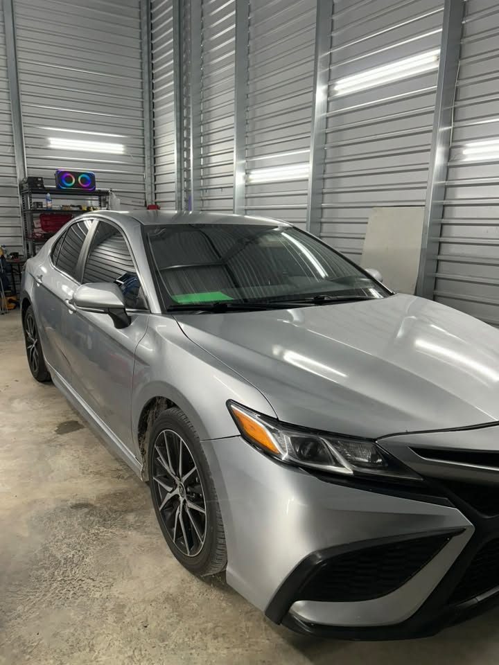 A finished silver Camry with tinted windows
