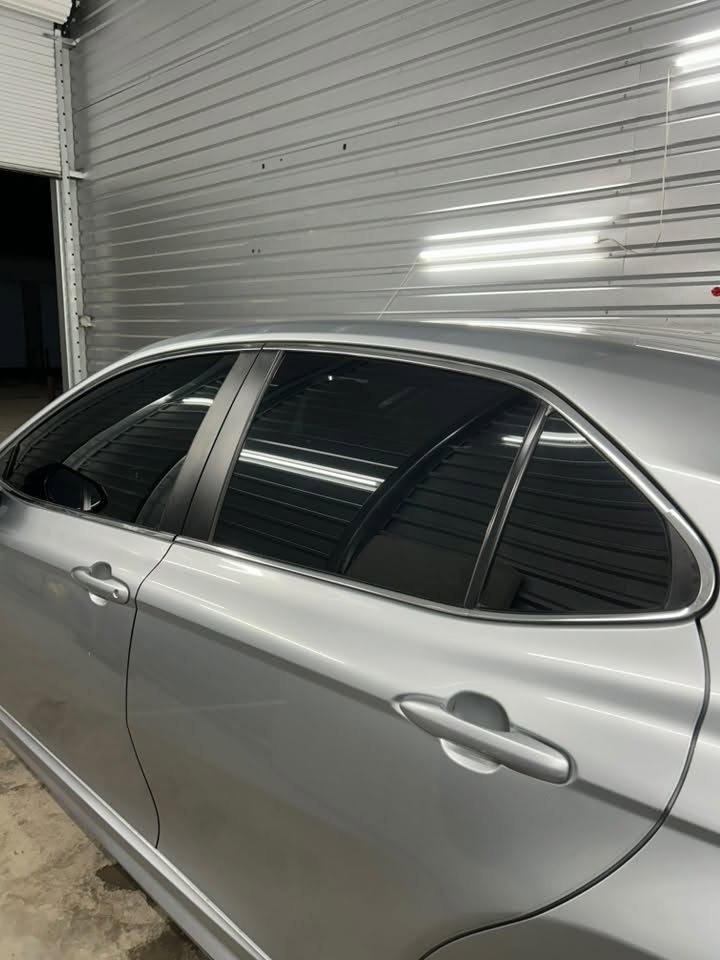 A close-up of evenly tinted windows on a finished vehicle